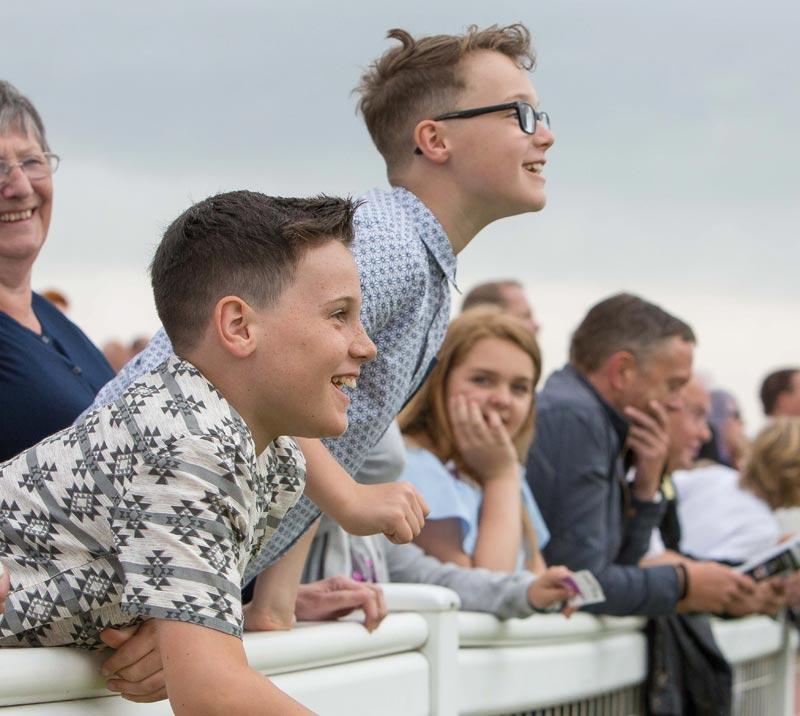 Children watching racing.