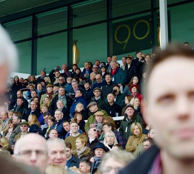Crowds watching racing.