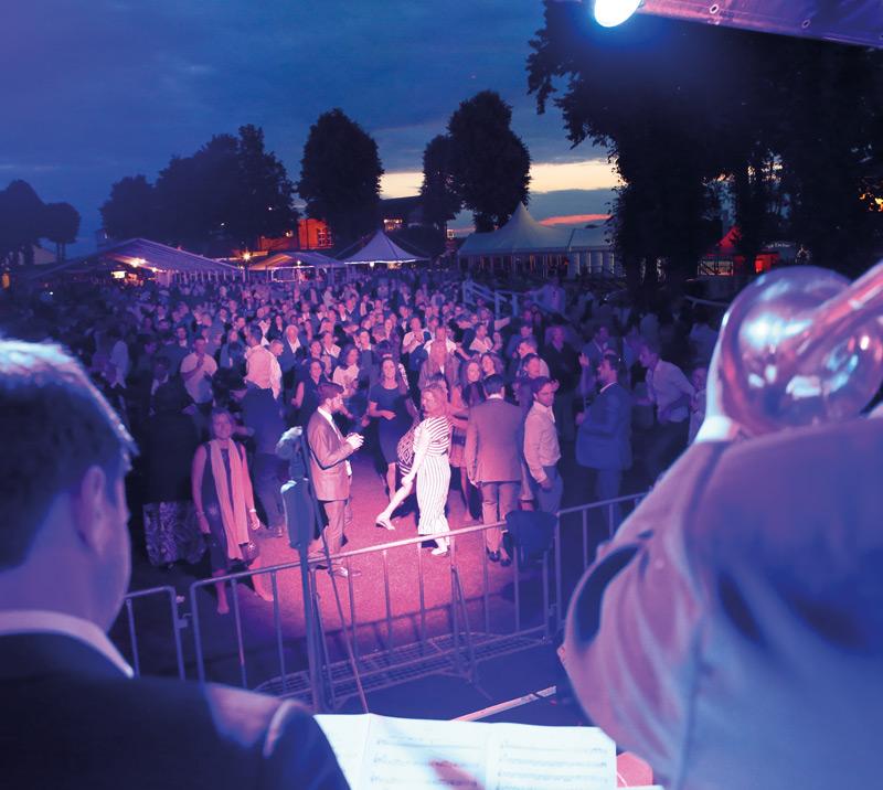 Crowds in front of a stage.