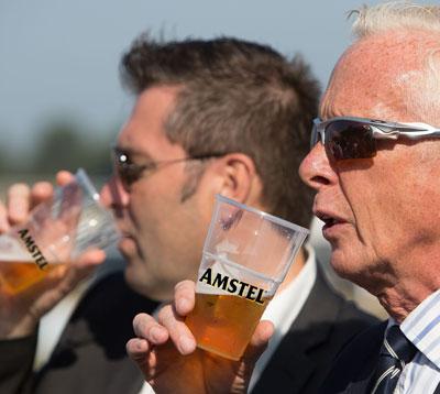 Two men drinking beer.